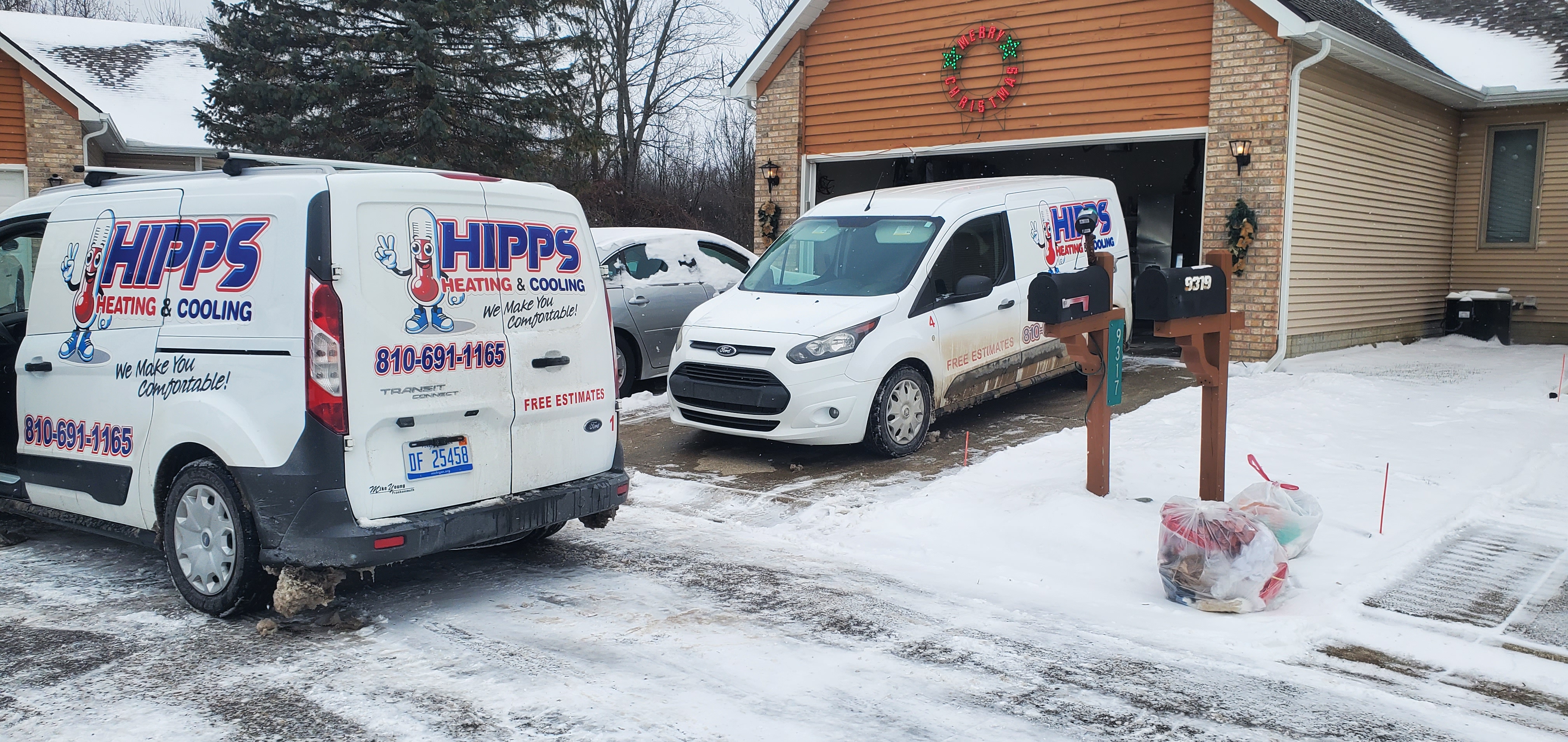 Hipps Heating and Cooling service vans in Flint Michigan